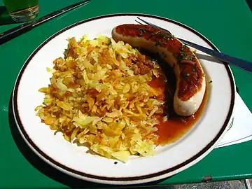 Rösti with veal sausage and onion sauce