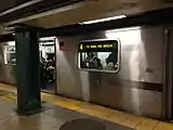 A 4 train made of R142 cars at the station, bound for Bowling Green