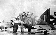 Brewster B-339E of No. 243 Squadron. This aircraft was flown by Flying Officer Maurice Holder, who flew the first Buffalo sortie in the Malayan Campaign on 8 December 1941, strafing landing barges on the Kelantan River. Damaged by ground fire, it was abandoned at RAF Kota Bharu, where it was captured by the Japanese.