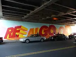 Mural on 63rd Drive at the LIRR overpass. The words "Real Good" are painted onto the mural.