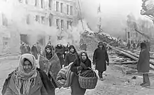 Image 50Residents of Leningrad leave their homes destroyed by German bombing. About 1 million civilians died during the 871-day Siege of Leningrad, mostly from starvation. (from Soviet Union)