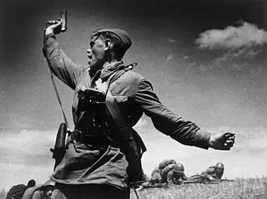 Image 1KombatPhotograph credit: Max AlpertKombat (Russian for 'battalion commander') is a black-and-white photograph by Soviet photographer Max Alpert. It depicts a Soviet military officer, armed with a TT pistol, raising his unit for an attack during World War II. This work is regarded as one of the most iconic Soviet World War II photographs, yet neither the date nor the subject is known with certainty. According to the most widely accepted version, it depicts junior politruk Aleksei Gordeyevich Yeryomenko, minutes before his death on 12 July 1942, in Voroshilovgrad Oblast, now part of Ukraine. The photograph is in the archives of RIA Novosti, a Russian state-owned news agency.More selected pictures