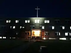 RMC at night, with new cross replacing bell tower.