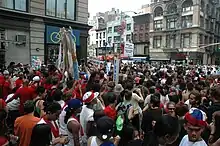 image of a crowd of people filling the street in protest