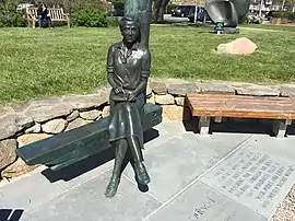 A statue of a young Rachel Carson, documenting a moment captured in a photo in 1951 by Edwin Gray near Sam Cahoon’s fish market dock in Woods Hole, Massachusetts.