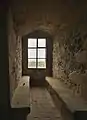 Window with bench in a square tower