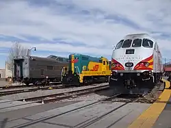 Santa Fe Depot, with a Rail Runner Express train (right), alongside a diesel locomotive and ex-Santa Fe Pleasure Dome operated by the SFSR