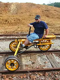 Three-wheeled handcar designed to be operated by a single person, widely known in the United States as a handcar or velocipede