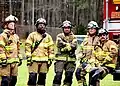 Raleigh firefighters at a high school demonstration