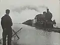 NS locomotive 3752 with freight train on the 'bathtub railway' through the Kruiningerpolder after the flood of 1953; 11 June 1953.