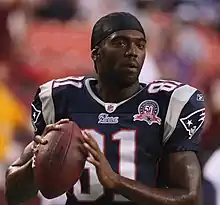 Randy Moss holding a football