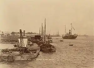 Image 28The paddle steamer Ramapoora (right) of the British India Steam Navigation Company on the Rangoon river having just arrived from Moulmein. 1895. Photographers: Watts and Skeen (from History of Myanmar)