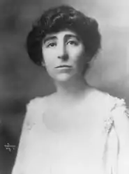 Portrait of woman in dark hair and white dress