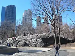 East side of Rat Rock with high rise buildings in the background