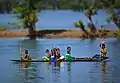 Children in a boat on the Shari-Goyain River in Ratargul Swamp Forest