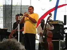 Ravi Coltrane (left, in black shirt) with Terell Stafford and Charnett Moffett at the Newport Jazz Festival on August 13, 2005.