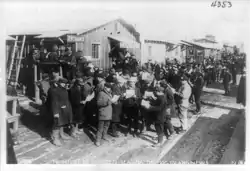 Workers reading The Hog Island News in 1918