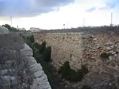 Looking along the rear ditch towards the causeway, where the musket ports that command the rear ditch, can be seen.