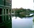 A reflection of a bridge in the portion of the canal that flows through downtown Indianapolis