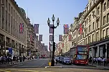 Looking north along Regent Street, with Union Flags hung between buildings