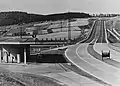 Early Reichsautobahn filling station, in the triangle formed by the exit and access ramps, with noticeboard in the median to inform drivers of telephone messages. The location is at today's exit "Kassel Nord" on the A 7.