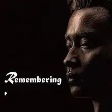 A portrait sculpture of Leslie Cheung against a black background