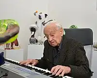 René Roubíček, aged 96, plays the piano at Jiří Pačinek's Tripartit Gallery (2018)