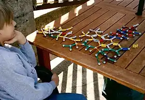 A boy with Asperger's playing with magnetic toys.