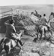 Riders wading through water, ca. 1895.