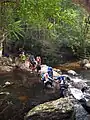 Hikers fording near Kuala Juram