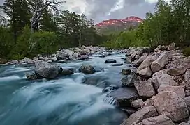 Sunset by a river in the heart of Trollheimen mountains near Trollheimshytta