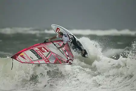 Image 5Robby NaishPhoto credit: Hoch ZweiAmerican windsurfer Robby Naish at the 2006 Windsurf World Cup, off the coast of Sylt, Germany. Naish was one of the first athletes to gain long-lasting international fame as a windsurfer. He won his first overall World Championship title, at the age of 13.More selected pictures