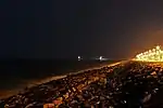 Promenade beach at night showing harbor