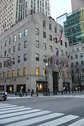 Facade of the Palazzo d'Italia, a six-story structure attached to the main tower, as seen from Fifth Avenue and 50th Street