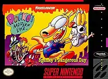 Box art for the video game Rocko's Modern Life: Spunky's Dangerous Bay, featuring the two characters Rocko and Spunky being chased by animals.