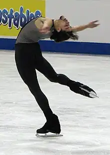 A man performs layback spin(Rohene Ward)