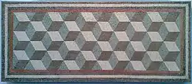 An ancient Roman geometric mosaic. The cubic texture induces a Necker-cube-like optical illusion.