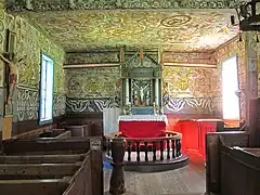 Altar, crucifix, baptismal font