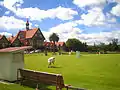 Oblique view of the museum, with croquet lawn in front.