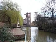 Looking upstream from Foss Bridge to Rowntree Wharf, with Wormald's Cut to the right.53°57′29″N 1°04′38″W﻿ / ﻿53.957975°N 1.07725°W﻿ / 53.957975; -1.07725