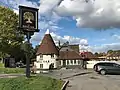 A replica Kentish oast house, now the Royal Oak pub, The Oast House was added to the original pub.