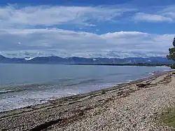 The view from Ruby Bay beach across Tasman Bay to Nelson and the Barnicoat Range.