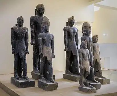 Statues of various rulers of the late 25th Dynasty–early Napatan period: Tantamani, Taharqa (rear), Senkamanisken, again Tantamani (rear), Aspelta, Anlamani, again Senkamanisken. Kerma Museum.