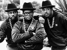 Run-DMC in a promotional shot. From left to right: Jason Mizell, Darryl McDaniels, and Joseph Simmons.