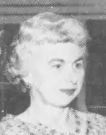 White woman with pale hair, black-and-white newspaper photo.