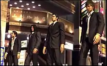 Game screenshot of four young men in suits