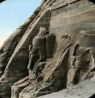 View of the partially excavated Great Temple from the right, with a human figure for scale