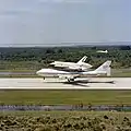 Columbia, mated to the Shuttle Carrier Aircraft, arrives at Kennedy Space Center after STS-1 to be prepared for its next mission.