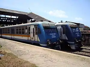 Two commuter trains side by side