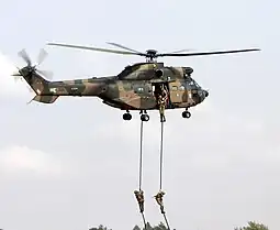 Soldiers fast roping from an Oryx helicopter